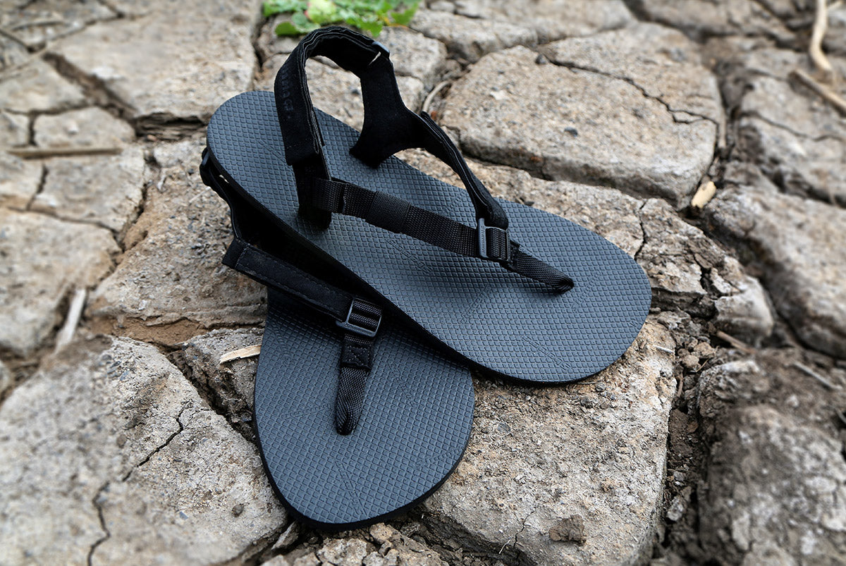 Shamma Chargers sandals on rocky ground