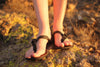 Shamma Sandals All Blacks women's toes front view on rocks