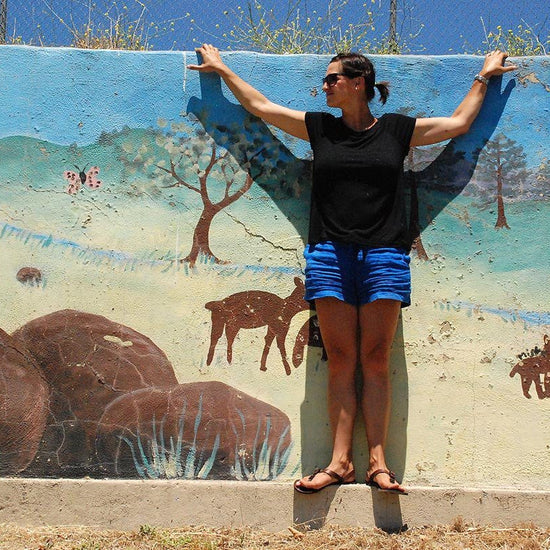 Woman wearing Shamma All Browns mural