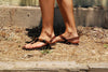 Shamma Old Goats leather sandals woman walking on dirt