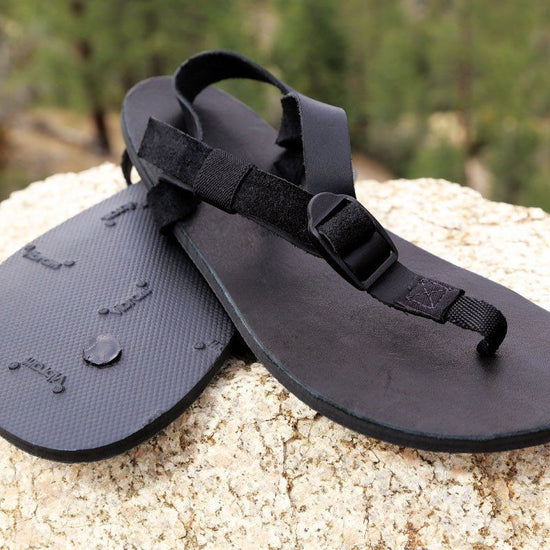 Shamma All Blacks Sandals Pair on Rocks