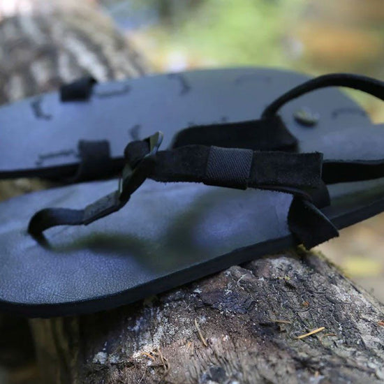 Shamma All Blacks sandals on forest branch