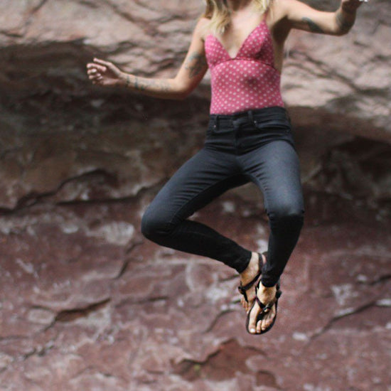 Shamma All Browns Sandals woman jumping in air