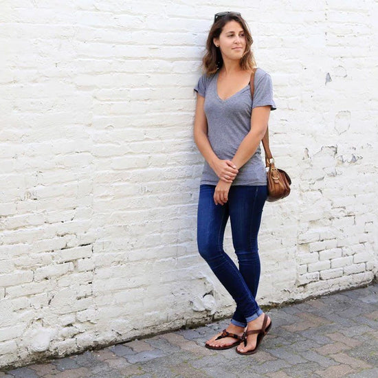 Woman in Shamma All Browns sandals standing downtown