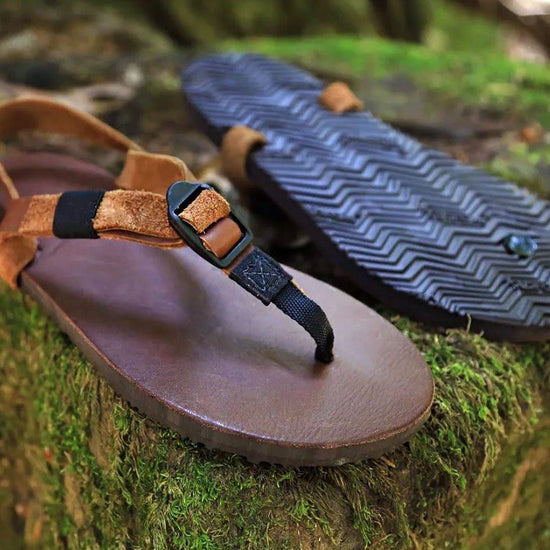 Shamma Old Goats leather sandals on mossy rocks three quarter view
