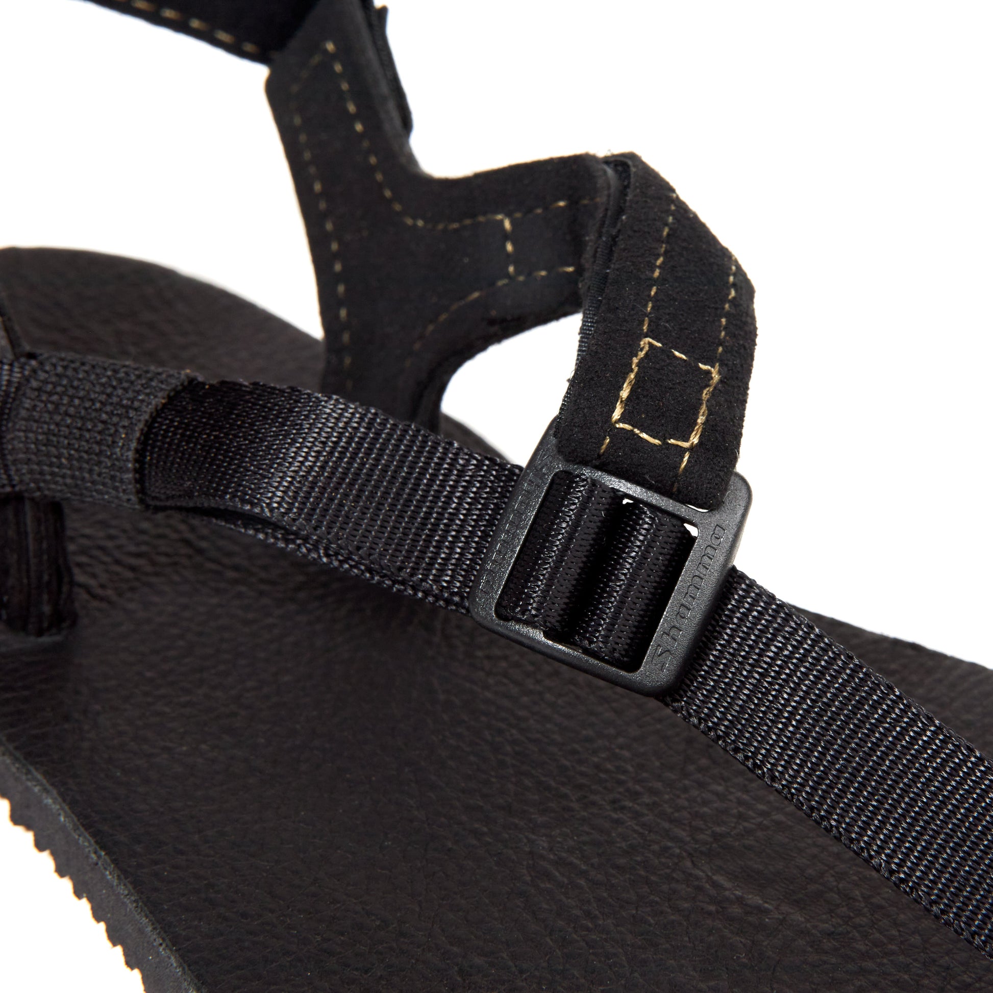 The Buckle on the Black Leather Shamma Power Sandals.
