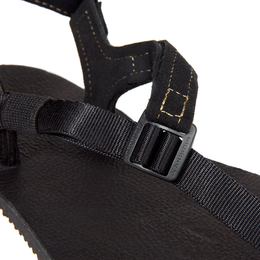 The Buckle on the Black Leather Shamma Power Sandals.