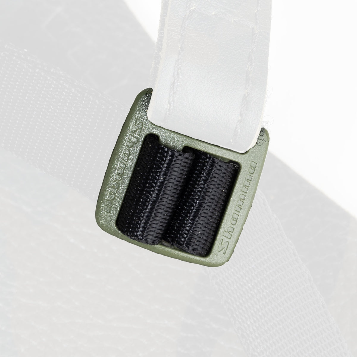Green Shamma Elite Color Buckle installed on a sandal, with the rest faded
