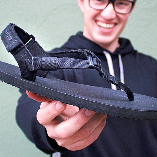 Holding Mountain Goats sandals happy