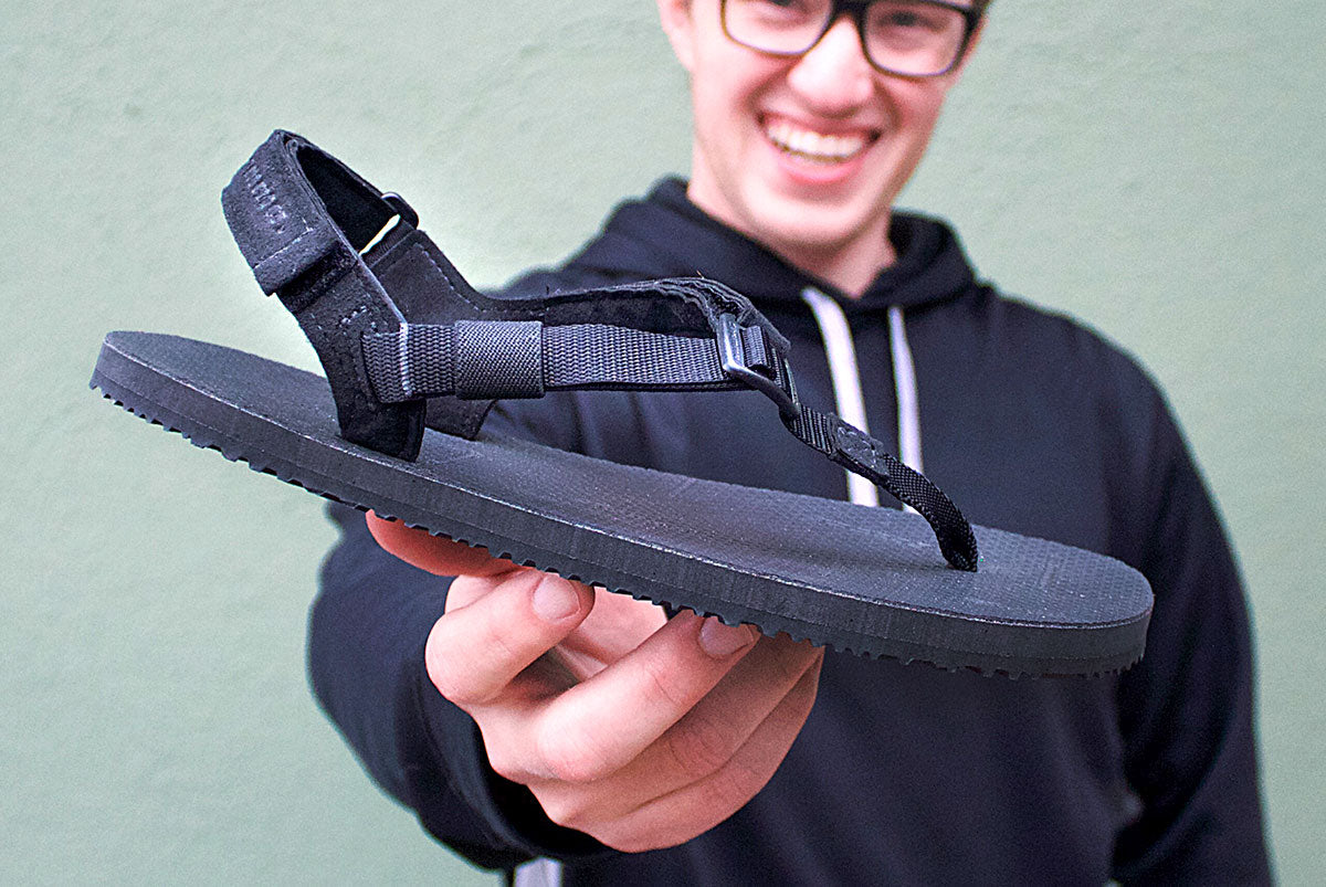 Holding Mountain Goats sandals happy