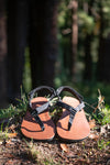 A pair of leather Shamma Maximus resting in the forest.