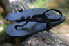 Shamma All Blacks sandals on forest branch