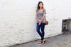 Woman in Shamma All Browns sandals standing downtown